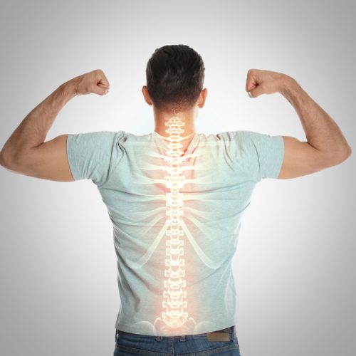 Man,With,Healthy,Back,On,Light,Background.,Spine,Pain,Prevention